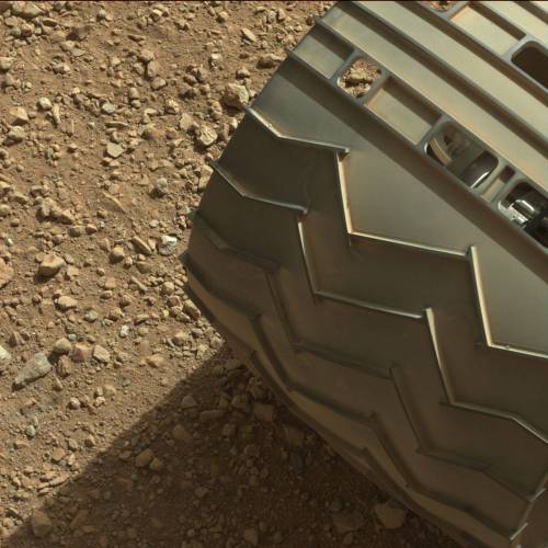 close-up photo of MSL Curiosity rover’s wheel on Mars