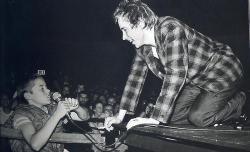  [Johnny Rotten letting a young fan borrow