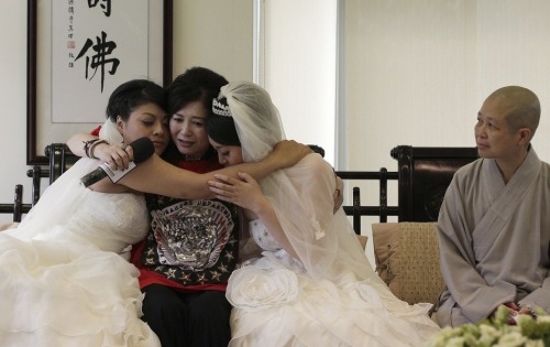 quirkytaiwan:  13 Photos From Taiwan’s First Same-Sex Buddhist Marriage Huang Mei-yu and Yu Ya-ting wed Saturday in a traditional Buddhist ceremony. Their union still isn’t recognized by the Taiwanese government, though support for gay marriage