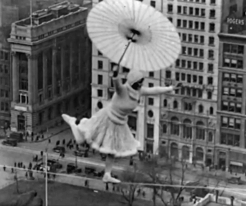 hadesworld:Crazy woman dances on a tightrope 300ft high with no harness, 1931