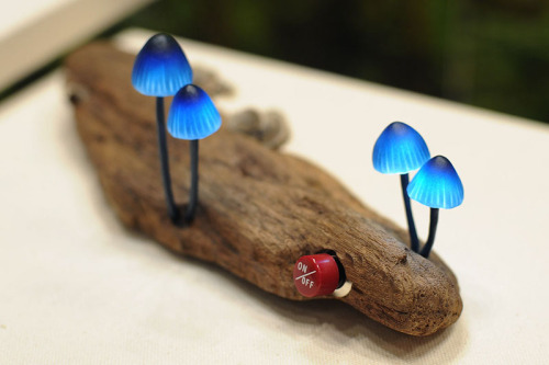  ardentblue:  Mushroom lamps by Japanese company Great Mushrooming made of glass, LED lights, and waste wood. Unfortunately they are not currently for sale outside of Japan. More information at the company’s website (in Japanese). [via thedesignhome]