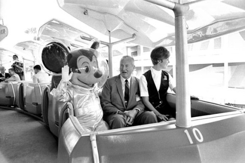 Mickey takes a ride on the PeopleMover in Tomorrowland. 