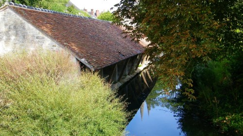 A restored medieval lavoir along the river Ornephoto by The Baguette