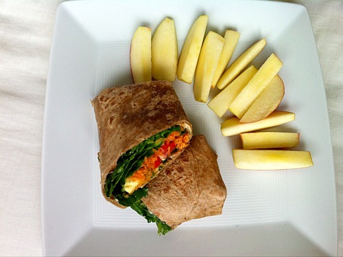 againsttheflub:chef-ru:Wheat and rye wrap with hummus, spinach, carrot, tomato and avocado and an ap
