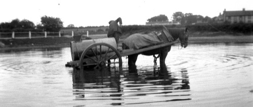 Filling The Water Cart (by Myopic Fish) A photograph of a water cart being filled (circa 1922/1923 &