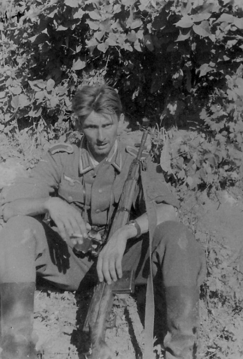 German non-commissioned officer, armed with a semi-automatic rifle captured Soviet SVT-38.
