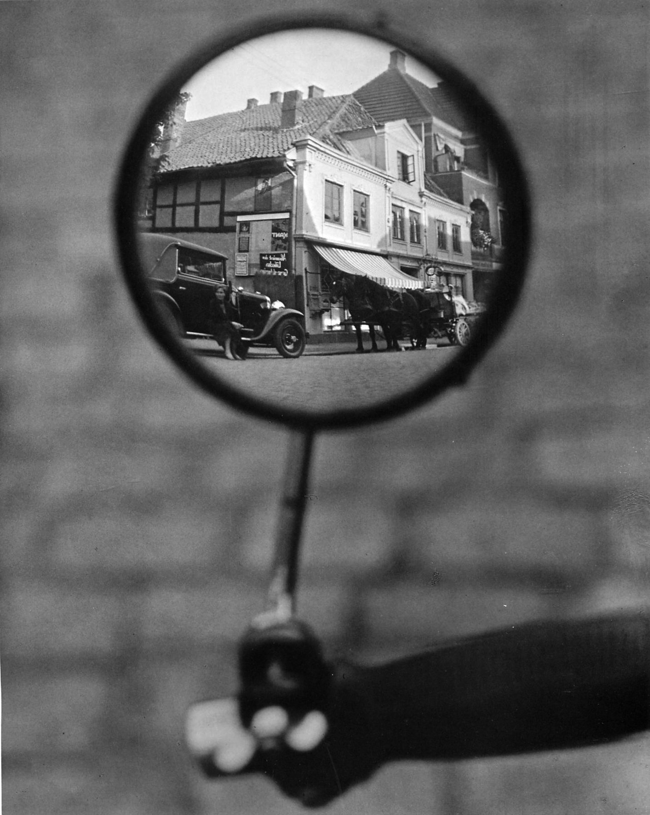 onlyoldphotography:  Martin Munkacsi: Reflection in a motorcycle mirror, Berlin,