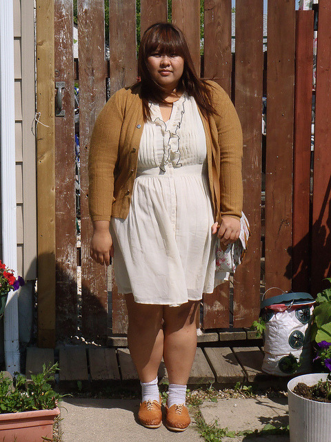 Gazel of Bonjour Gazel in an adorbs, vintage-librarian-inspired outfit.