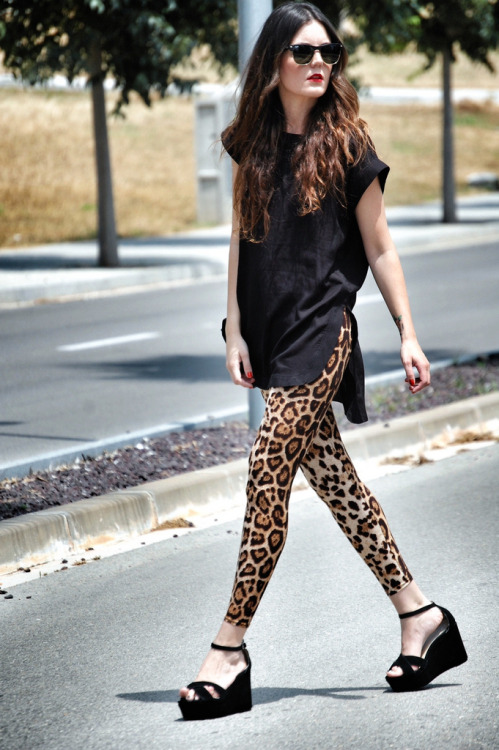 Barcelona fashion blogger Laura of Views, by Laura rocking black, studs, and a wild animal print.