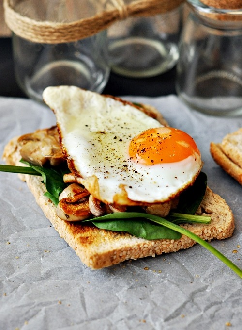 foodiebooty:Toast with Sauteed Mushrooms, baby Spinach, Herbs and Garlic, Topped with a Sunny Side u