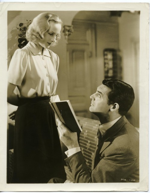 Cary Grant interrupted while reading by Carole Lombard. In Name Only (1939).  While out riding 