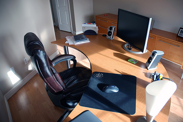 I love how the light is shining in on this semi-circular desk.