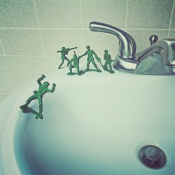 brockdavis:  At ease, soldier. My son asked me why his army men are on standing on skateboards. So we made this scene for fun. Cut the rifle out of this soldier’s hands, glued rocket launcher pieces to make the wheels and glued him to the sink.  