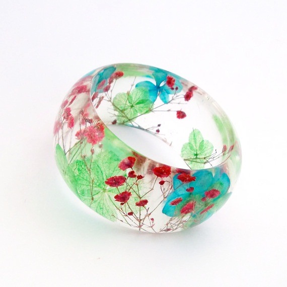 bookspaperscissors:  Handmade contemporary jewelry with resin and real flowers, made