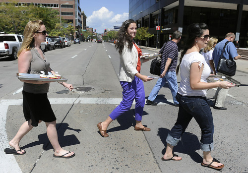 Our fearless leader handing out cupcakes in Denver, CO to strangers!