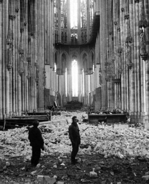 Soldiers wander through the bombed-out Cathedral of Cologne, 1945. George Silk