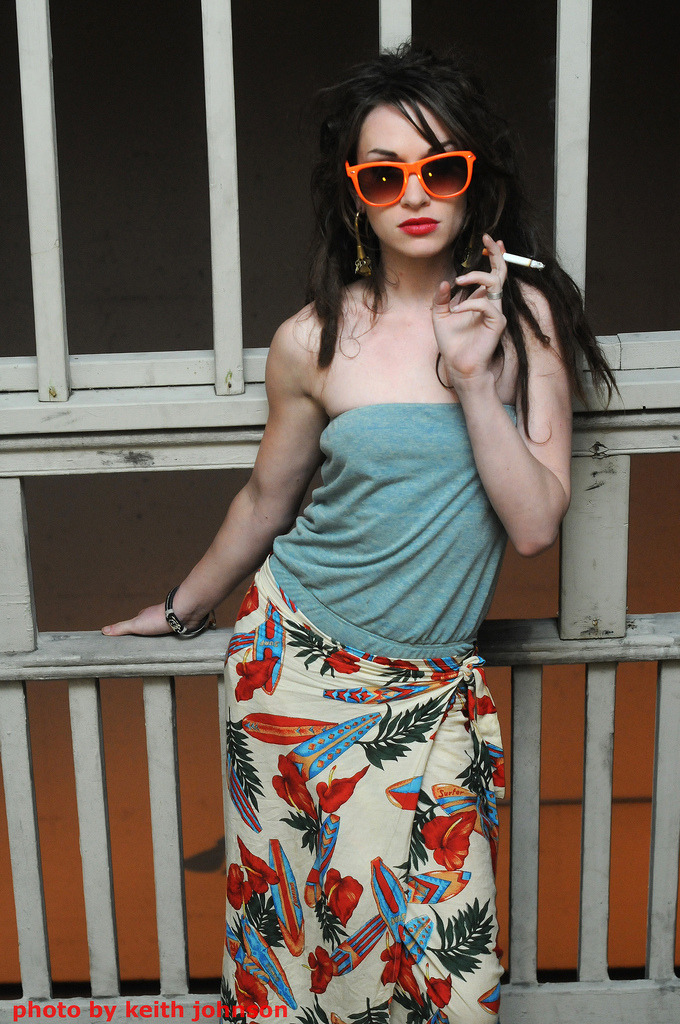 sexygirlssmoking:  She’s a sexy fancy smoking girl with red kissable lips. I like
