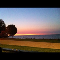 5:45am. Hello sunlight! #instaphoto #nofilter #sunrise #lakefront #mycity #water #trees #LSD #lakemichigan  (Taken with Instagram)