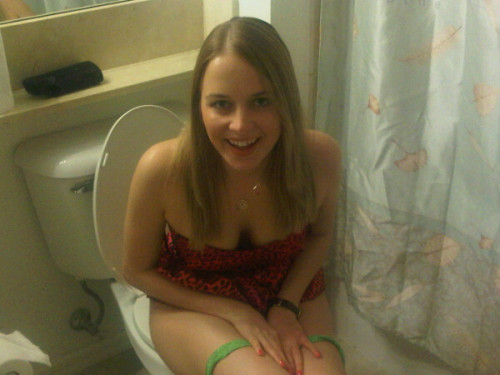 XXX beautiful babe on the toilet photo