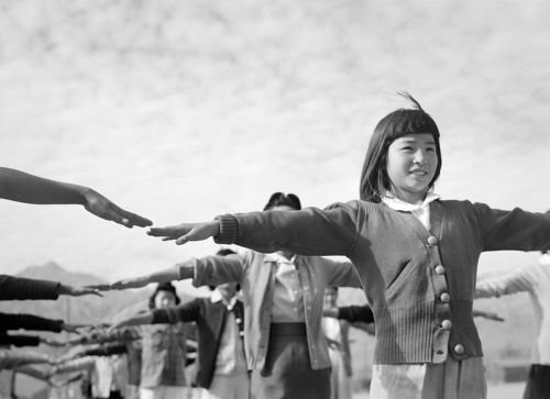 collectivehistory:Female internees practicing calisthenics at Manzanar War Relocation Center, Owen