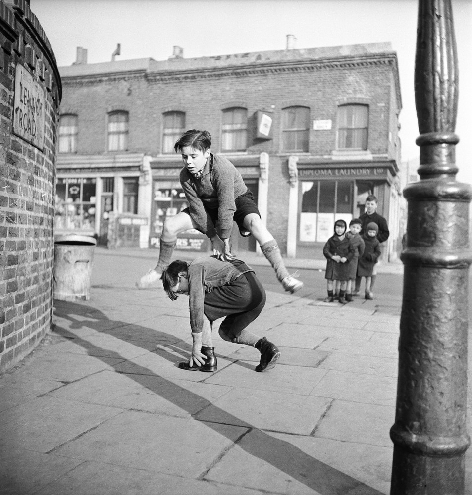 Bill Brandt
A group of children playing leap frog in the street, 1950