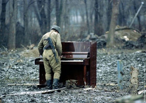 Russian Soldier plays an abandoned Piano