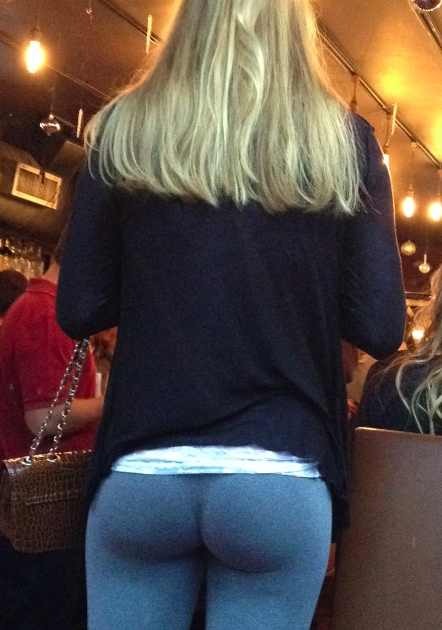 XXX Girl showing off her tight butt in yoga pants photo