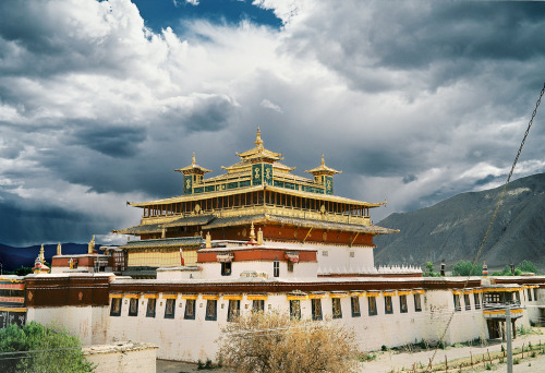 Radiating Samye with Rain Storm Aproaching Behind (by lylevincent)