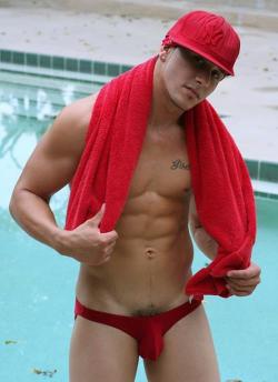 wilywilly:  Only in gay porn can you get a thug into a bikini that’s so small his pubes are showing. HOT! 