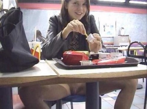 fastfoodflashers: Cute girl flashing her shaved pussy at McDonald’s