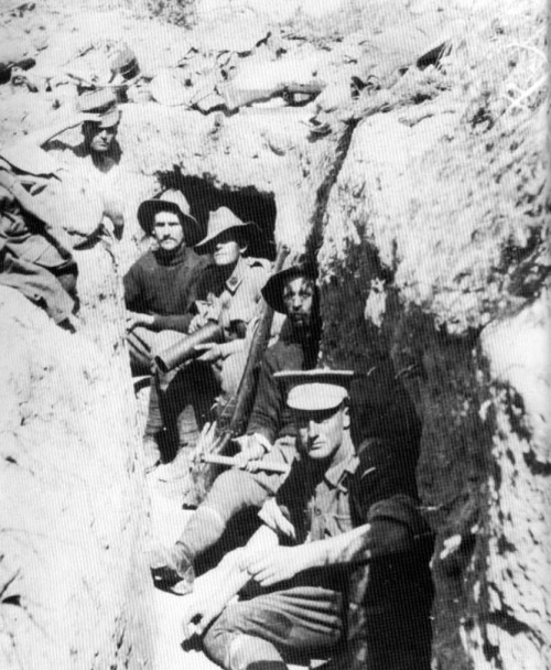 ANZACs relax in a recently captured Turkish trench.