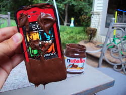 paradise-xoxo-96:  sea-full-of-bitches:  OMFG i’m so inlove with this picture first it has Nutella , then Hot Chelle Rae + the iphone ;)   But why the fuck would you dip your iPhone in Nutella……..