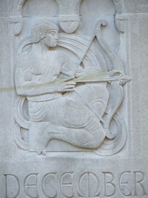 Bas-relief of the month of December on the front of 11 West 42nd Street features an image from the S