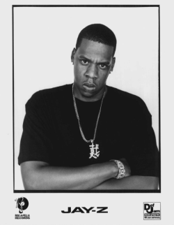 aintnojigga:  The Def Jam/Roc-A-Fella Vol. 2… Hard Knock Life promotional postcard. Jay-Z was photographed by Jonathan Mannion. 