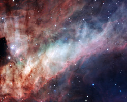 wavesoftware:  Messier 17: Omega  Three-colour composite image of the Omega Nebula (Messier 17, or NGC 6618), based on images obtained with the EMMI instrument on the ESO 3.58-metre New Technology Telescope at the La Silla Observatory.  North is down