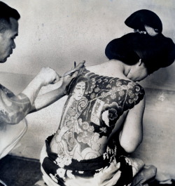 firsttimeuser:  Irezumi, 1937 This is a Press photo from 1937 that has been trimmed down from a larger photograph sometime during its life. On the back is typed the following: “Tattoo / Tattooing. Because they believe that tattooing makes them beautiful