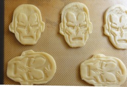 geekyfood:  Iron Man Pizza Hand Pies     Tony Stark is the man. No literally. THE man, Iron Man – and for some reason I can only envision little Iron Man hand pies filled with…pizza. Oh, so delicious. I used the Marvel cookie cutter set from Williams