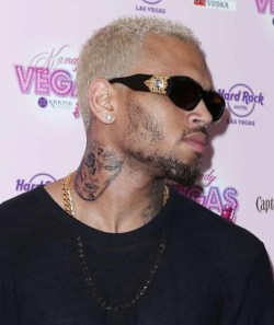 nerdgasmz:  blizooka:  thedailywhat:  Oh No He Didn’t of the Day: Chris Brown is keeping it classy with a new neck tattoo of a woman’s banged-up face — which naturally, he claims isn’t an homage to his ex Rihanna, and the beating he gave her