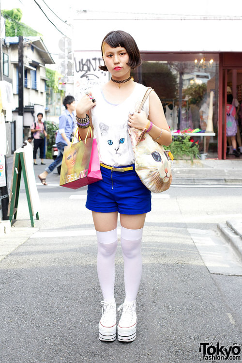 Japanese high school student w/ shaved hairstyle &amp; Ahcahcum Muchacha cat bag in Harajuku.