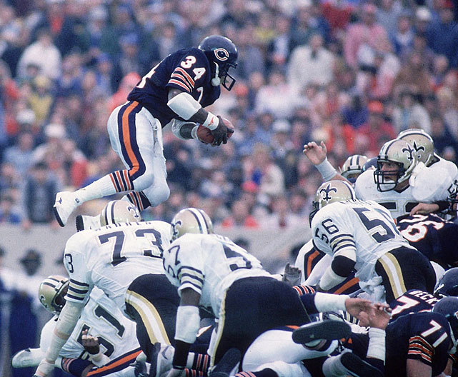 Walter Payton jumps over a pile of defenders to... SI Photo Blog