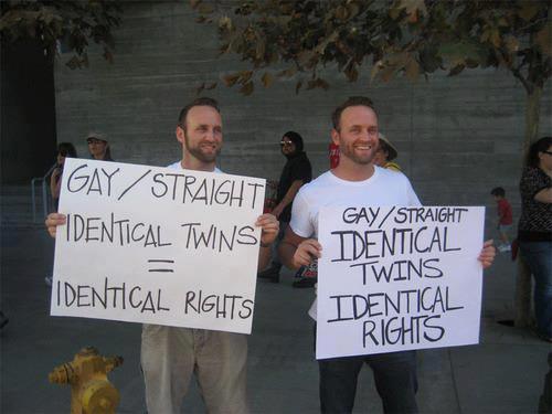 lgbtqgmh:  [Two men hold signs that read, â€˜Gay/straight. Identical twins =