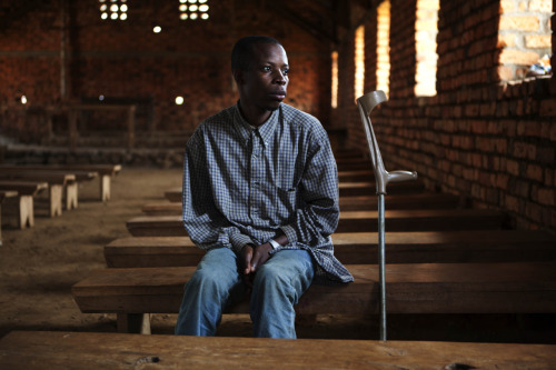 Photo: David Enabukonjo, DRC 2012 © Juan Carlos Tomasi
Surviving a Bullet Wound
David Enabukonjo uses a crutch to climb to the top of a hill in Bisisi, in eastern Congo. From here he can look out over a lush green landscape of forests and villages...