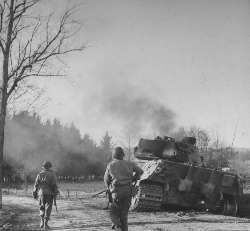 operationbarbarossa - An American patrol moves toward a...