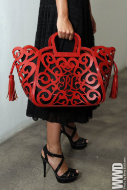 womensweardaily:  Accessory of the Day: Ralph Lauren Ralph Lauren’s ode to Spain and the iconic gaucho were manifested on his runway with fringe scarves, neckties, Basque-style hats and this fabulous filigree laser-cut tote with tassels.