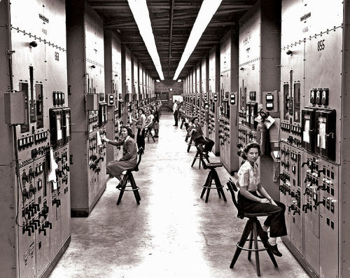 collective-history:Employees of the Manhattan Project operating calutron control panels at Y-12, in 