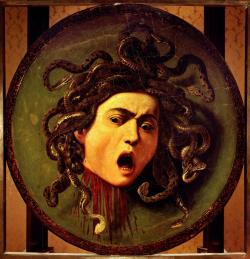 hominisaevum:  Shield with the head of Medusa Caravaggio, 1597 She - or he, as Caravaggio’s model is a male youth - is portrayed in the very moment of self-recognition. This is both a horrific and horrified image, as the eyes of the gorgon are fixed