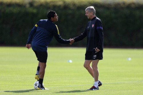 during a training session at London Colney on September 17, 2012 ahead of CL group stage match again