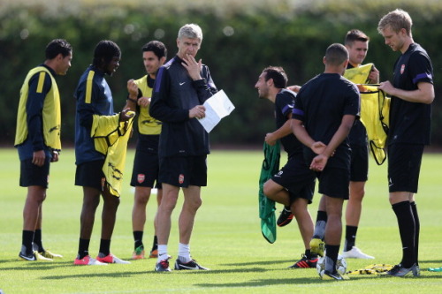 during a training session at London Colney on September 17, 2012 ahead of CL group stage match again