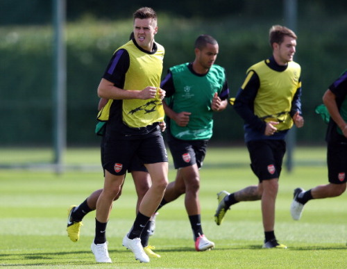 during a training session at London Colney on September 17, 2012 ahead of CL group stage match again