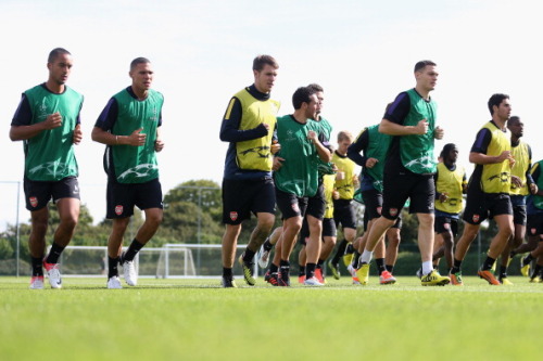 during a training session at London Colney on September 17, 2012 ahead of CL group stage match again